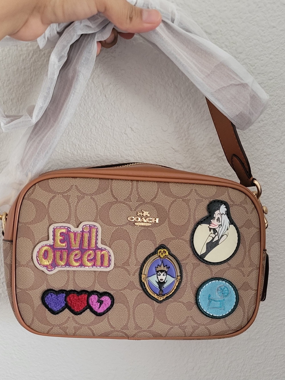 Fashion Beige Signature Canvas Crossbody with Villain Patch Accents